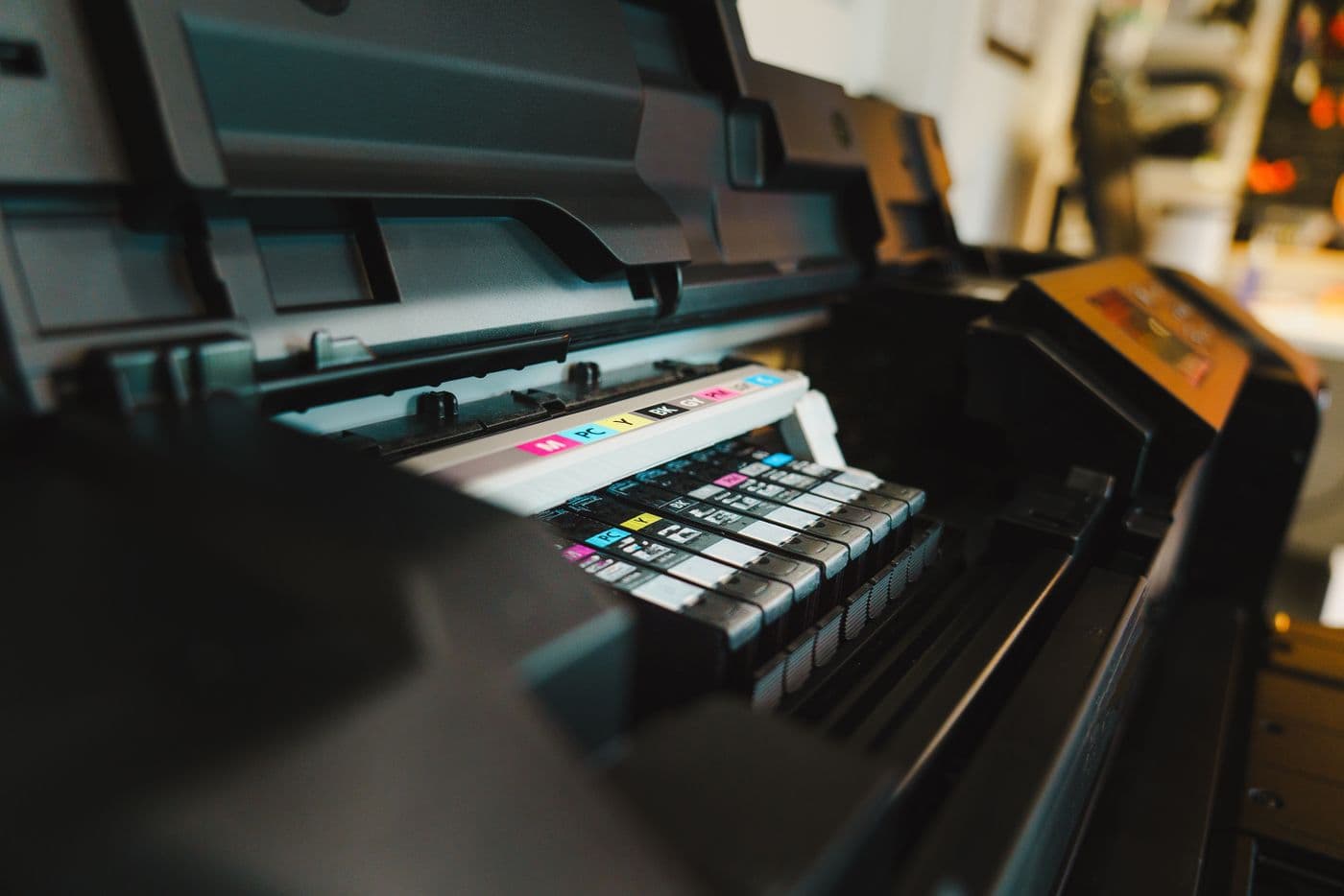 CMYK cartridge bay on a wide-format printer